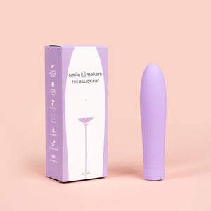 Vibrador The Billionaire junto a su empaque original de Smile Makers, diseño elegante y discreto en amani