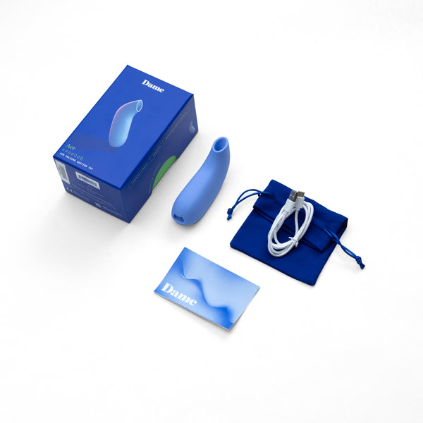 Contenido del succionador clitoriano Dame Aer con cable de carga y accesorios